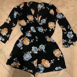 Cute black romper with orange and blue flowers